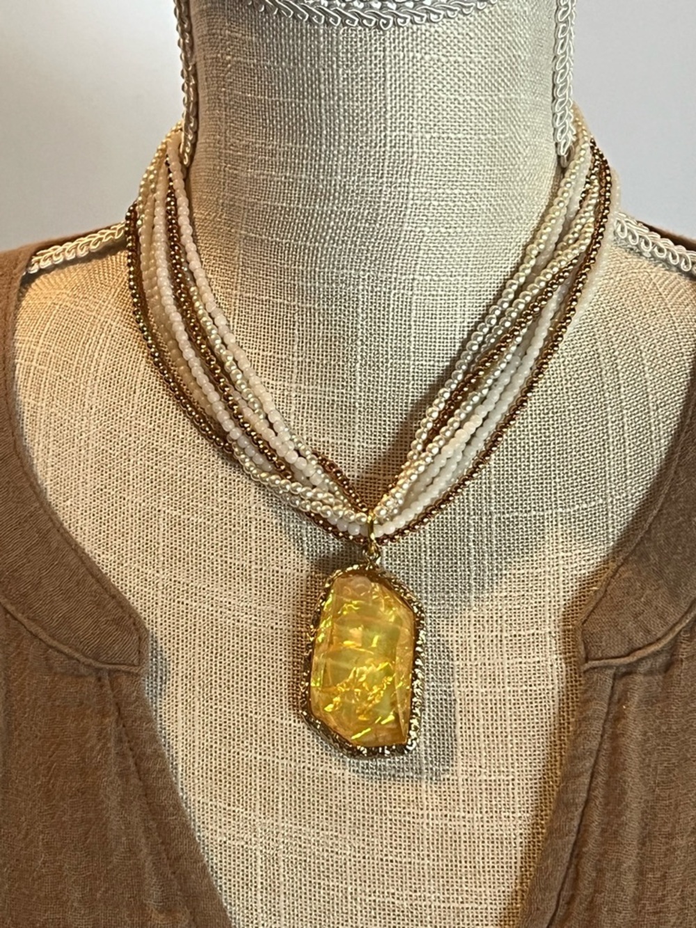 Layered White and Gold Beaded Necklace with Yellow Pendant